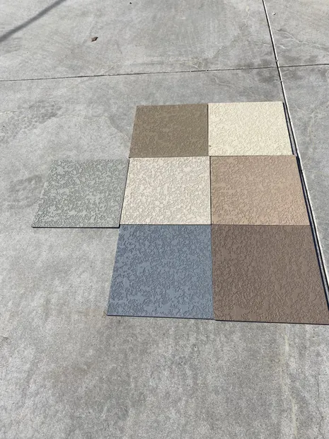 Six textured deck finish samples arranged in a grid showing tan, cream, gray and brown