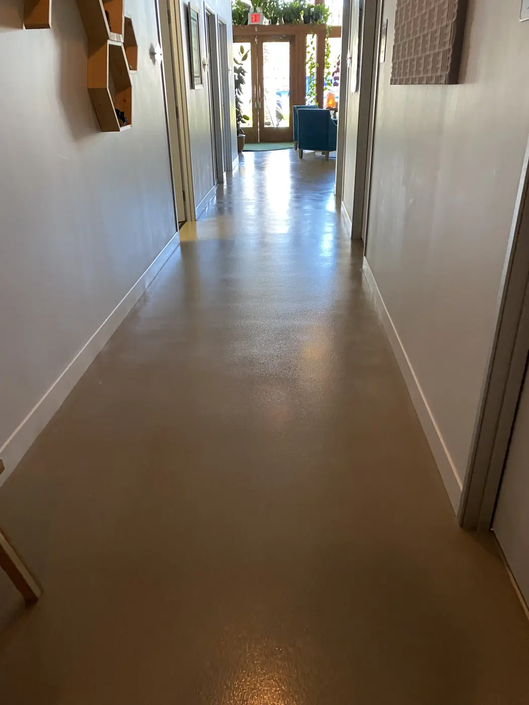 Long bronze flake epoxy corridor in a commercial building