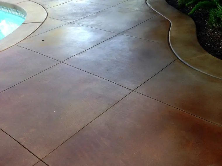 Pool and spa deck stained and scored into large tiles