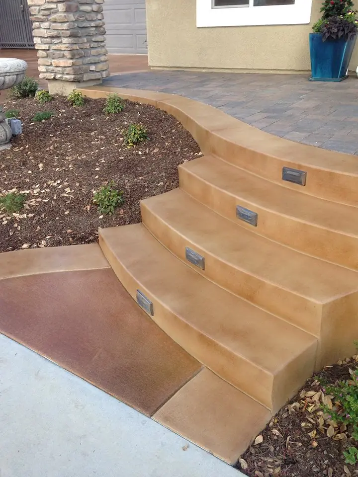 Tan and gold stained steps curving up to a walkway