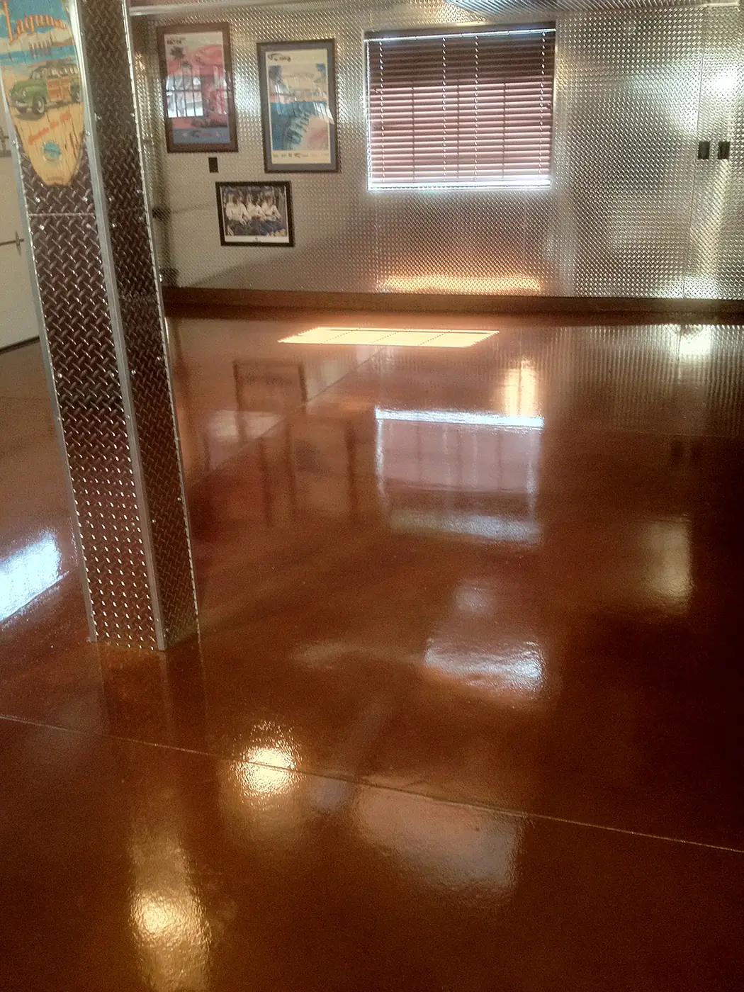 Polished copper stained concrete running down a residential hallway