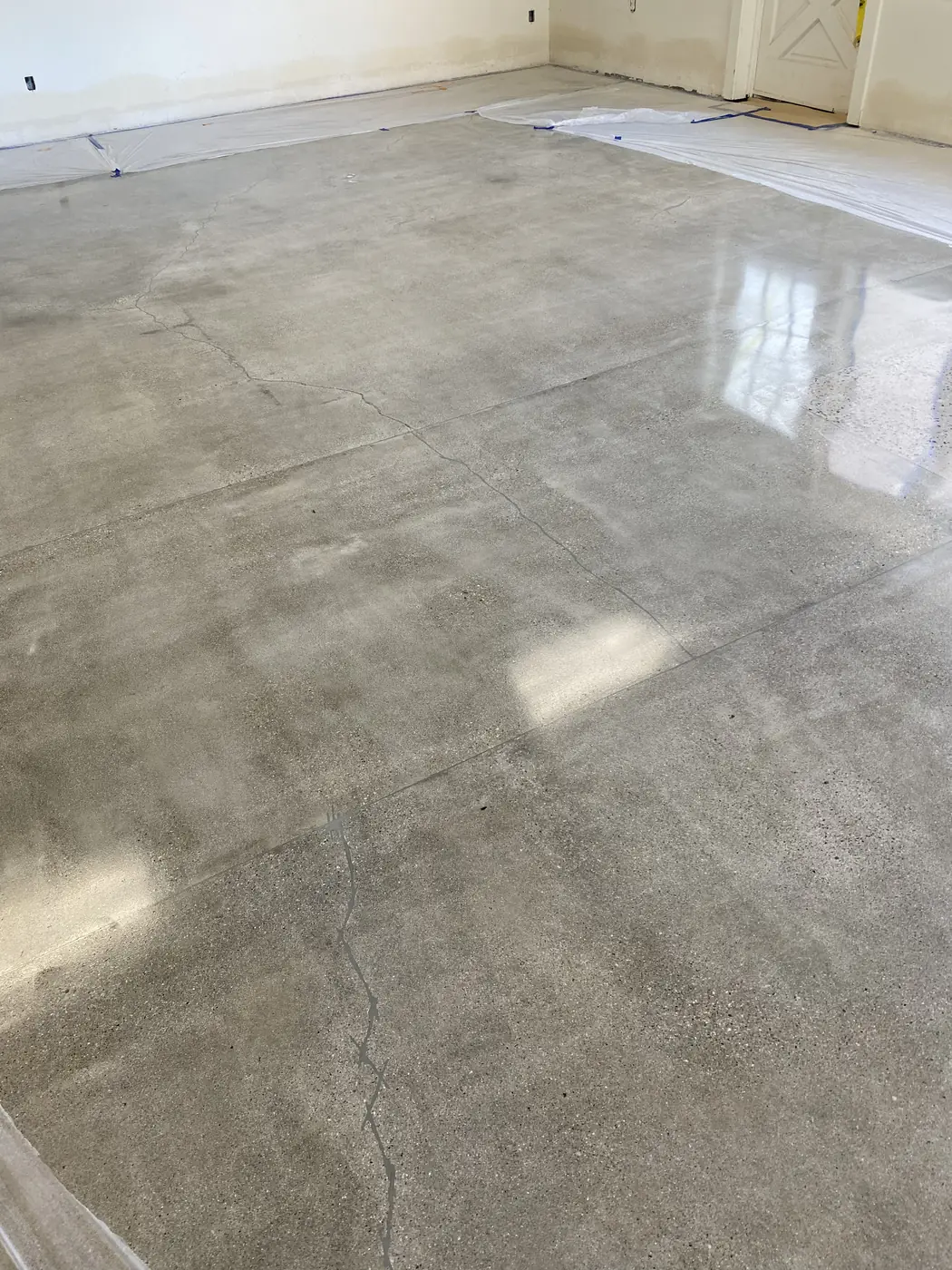 Polished gray concrete floor with the original slab joints showing through