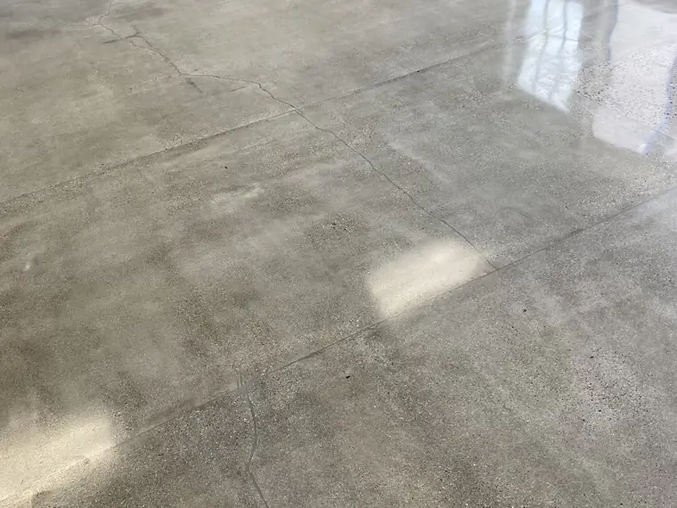 Polished concrete floor reflecting daylight across a large open room