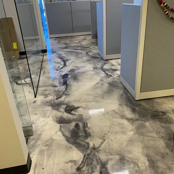 Gray metallic epoxy floor in an open-plan office bay