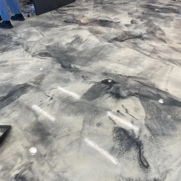 Close view of the gray and black marbling in a metallic epoxy floor