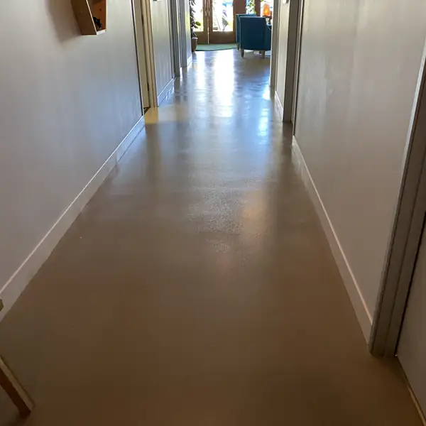 Long bronze flake epoxy corridor in a commercial building