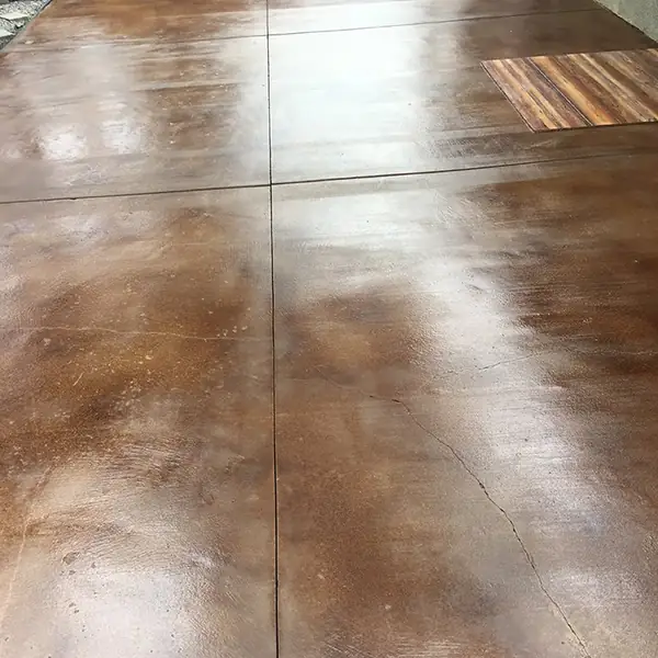 Long brown stained walkway with scored joint lines