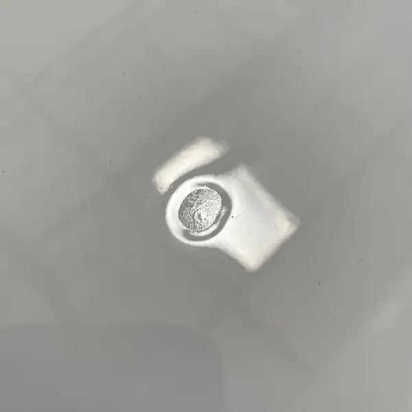 Close view of a floor drain set into a seamless gray epoxy floor