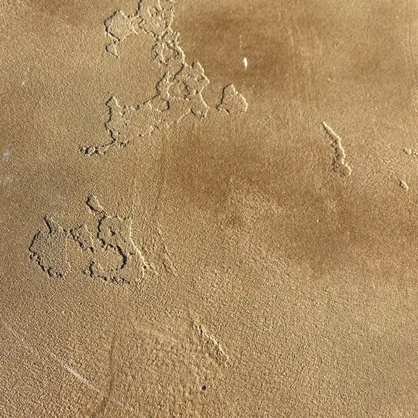 Close view of a trowel-textured tan microtopping surface