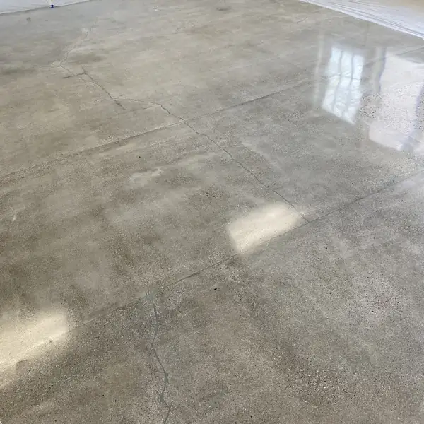 Polished gray concrete floor with the original slab joints showing through