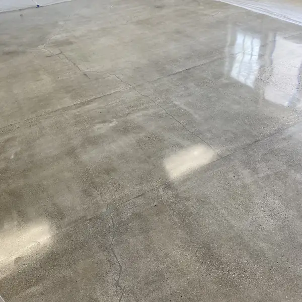 Polished concrete floor reflecting daylight across a large open room