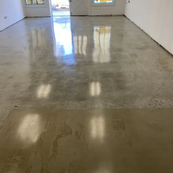 Polished concrete floor running to a glass entrance door