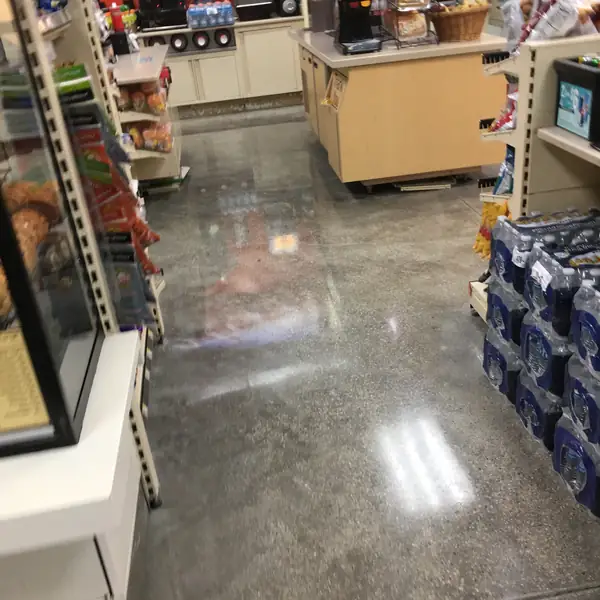 Polished store floor between shelving and the service counter