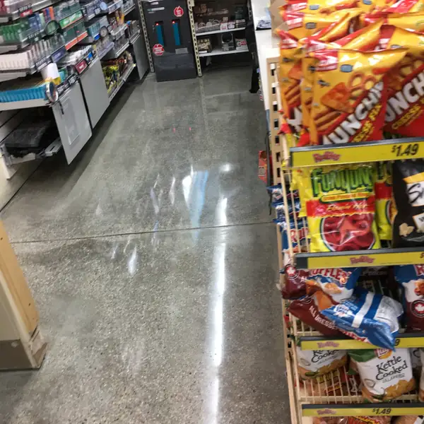 Polished concrete aisle floor in a convenience store
