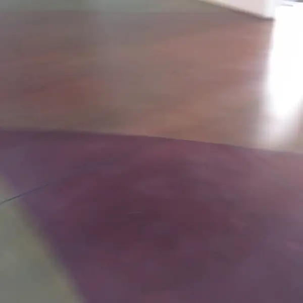 Close view of purple and orange staining blended into polished concrete