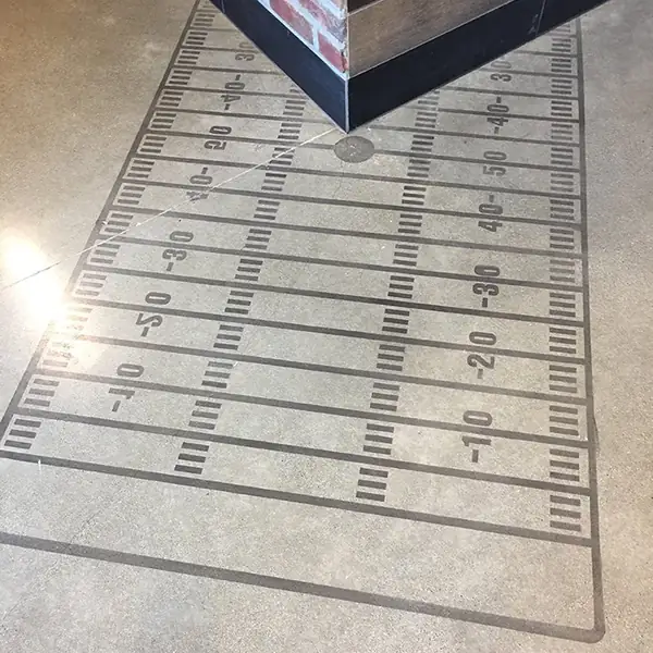 Football field graphic set into a polished concrete floor