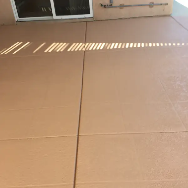 Terracotta pool deck with a clean control joint running across it