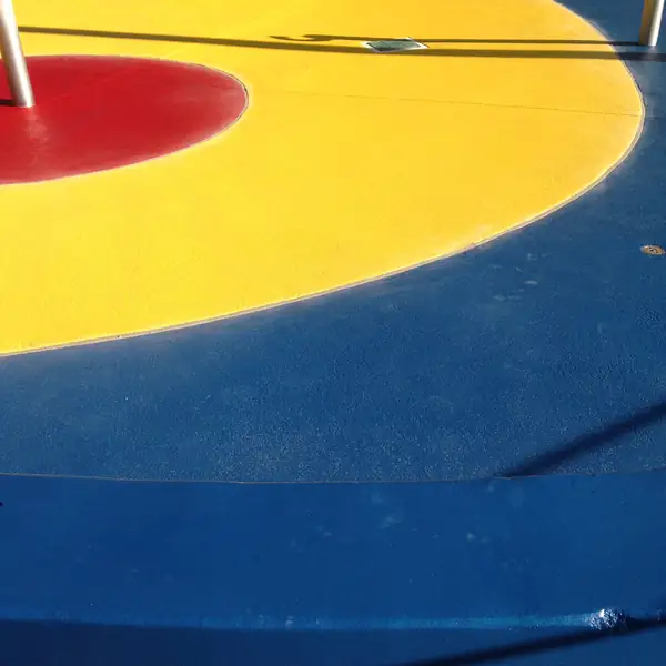 Yellow and blue splash pad coating with a red circle inlay